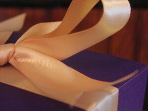 Satin ribbon on a purple gift box