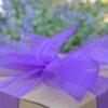 Small gift box of chocolate brownies - kraft box with a purple ribbon