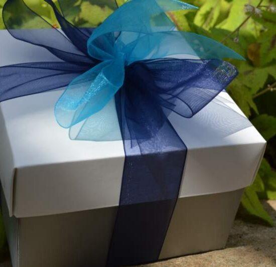 Silver gift box of gourmet cookies and brownies with a blue ribbon