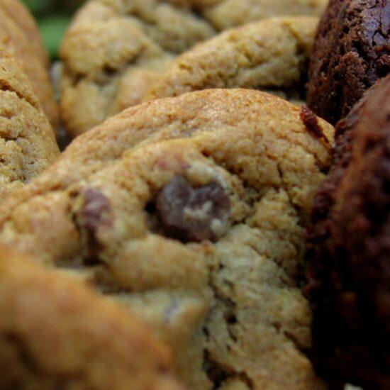 An up close photo of gourmet cookies and brownies in a standard gift basket