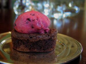 Rich chocolate brownie topped with raspberry sorbet