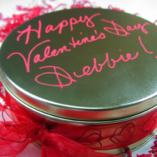 A custom tin of cookies and brownies for Valentine's Day