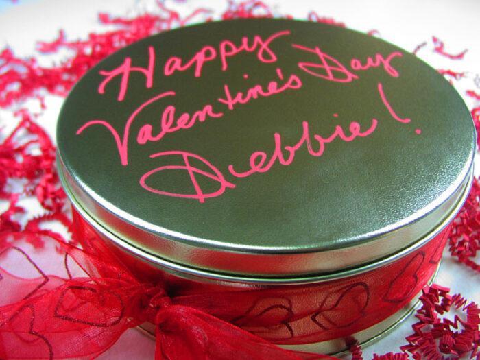A custom tin of cookies and brownies for Valentine's Day